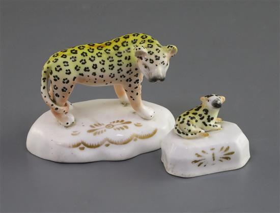 A Staffordshire porcelain figure of a leopard and a similar figure of a cub, c.1835-50, H. 7.7cm and 4.2cm